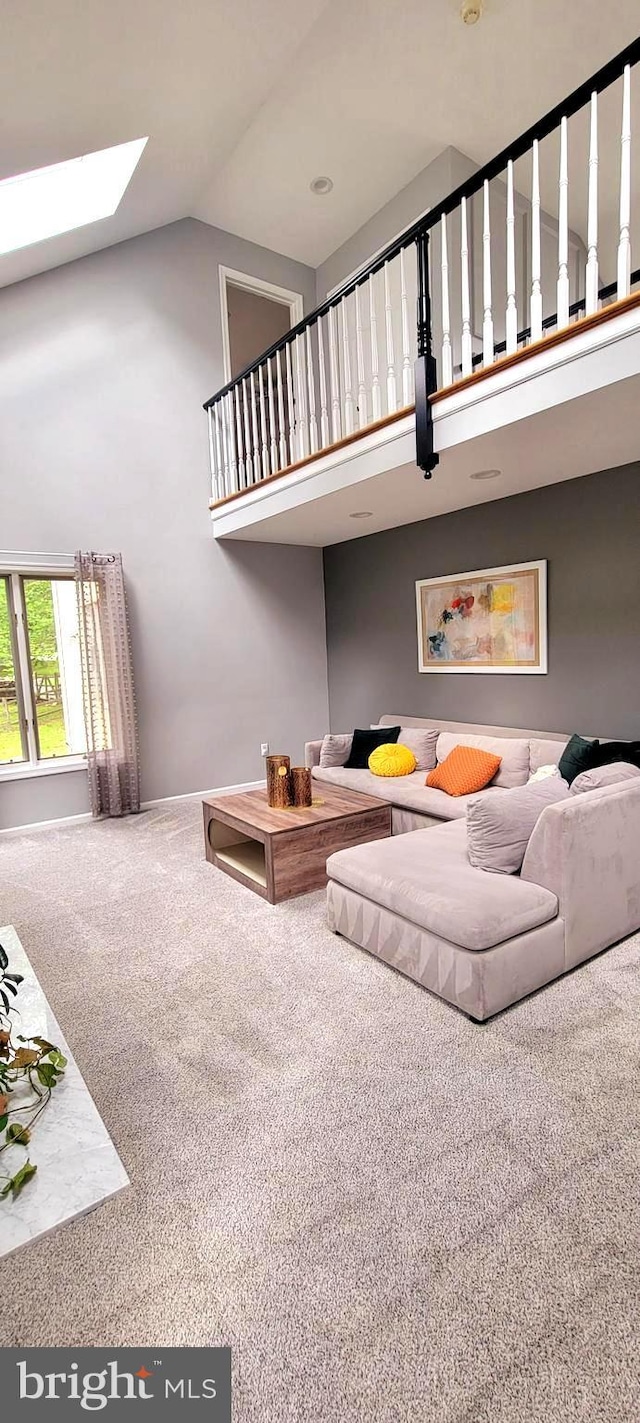 4 E Spring Oak Cir, Media, PA 19063 - living room with high vaulted ceiling, carpet flooring, and a skylight