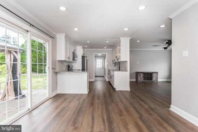 351 Doone Rd, Fairless Hills, PA 19030 - kitchen with stainless steel appliances, white cabinetry, baseboards, ornamental molding, and light stone countertops