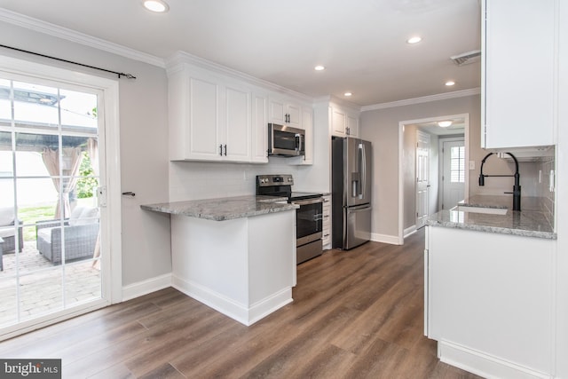 351 Doone Rd, Fairless Hills, PA 19030 - kitchen with appliances with stainless steel finishes, a sink, crown molding, baseboards, and white cabinetry