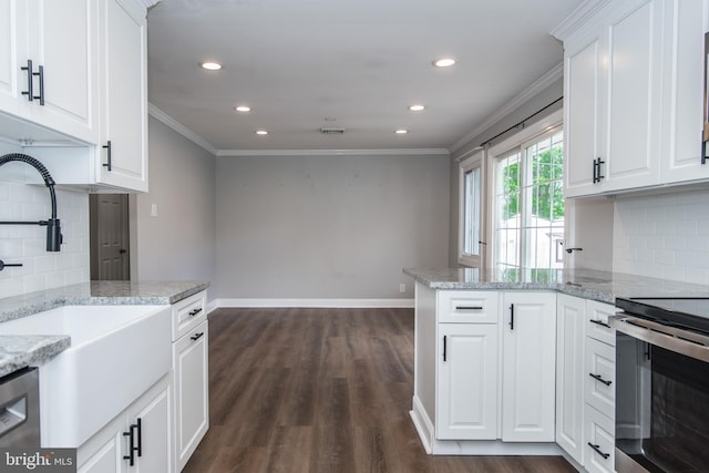 351 Doone Rd, Fairless Hills, PA 19030 - kitchen with a sink, crown molding, appliances with stainless steel finishes, dark wood-style floors, and white cabinetry