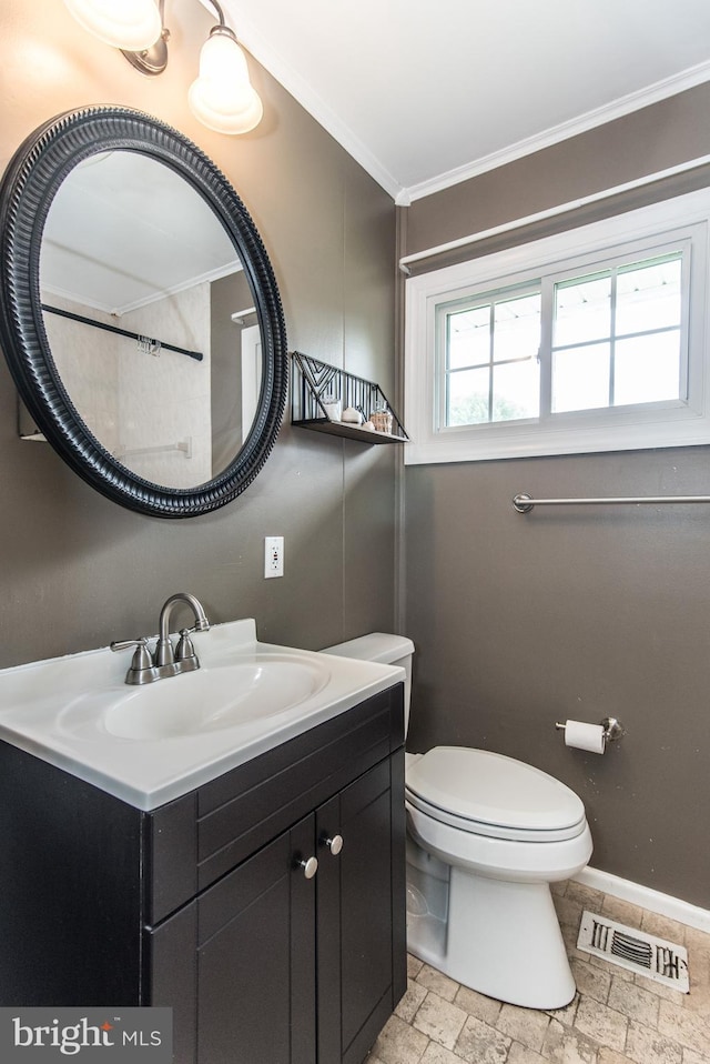 351 Doone Rd, Fairless Hills, PA 19030 - bathroom featuring crown molding, stone tile flooring, toilet, vanity, and baseboards