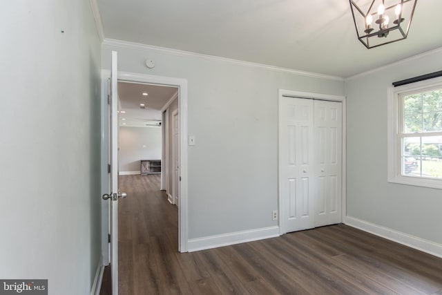351 Doone Rd, Fairless Hills, PA 19030 - unfurnished bedroom featuring dark wood-type flooring, ornamental molding, baseboards, a closet, and a chandelier