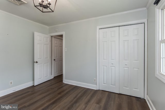 351 Doone Rd, Fairless Hills, PA 19030 - unfurnished bedroom featuring ornamental molding, dark wood finished floors, a chandelier, baseboards, and a closet