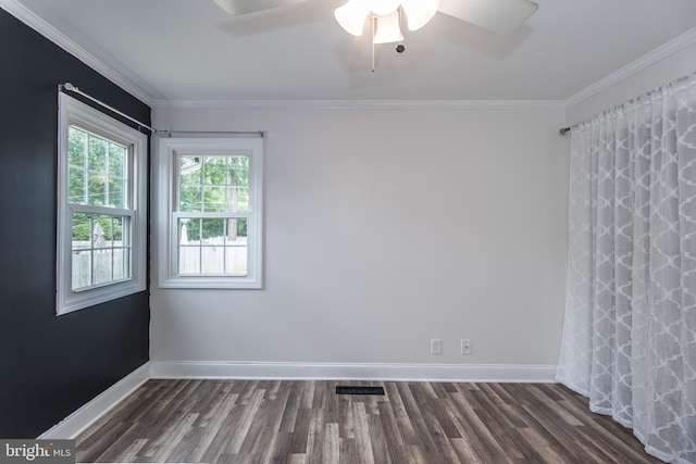 351 Doone Rd, Fairless Hills, PA 19030 - spare room with dark wood-type flooring, baseboards, ornamental molding, and a ceiling fan
