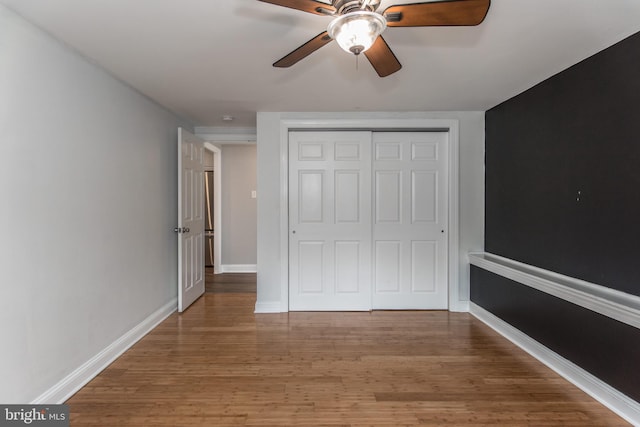 351 Doone Rd, Fairless Hills, PA 19030 - unfurnished bedroom featuring wood finished floors, a closet, baseboards, and a ceiling fan