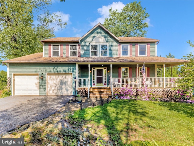7425 Rimrock Ct, New Market, MD 21774 - view of front of property featuring asphalt driveway, a front lawn, and a porch