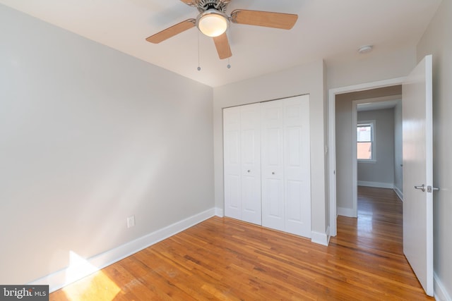 1738 Stokesley Rd, Baltimore, MD 21222 - unfurnished bedroom with light wood-style flooring, baseboards, a closet, and ceiling fan