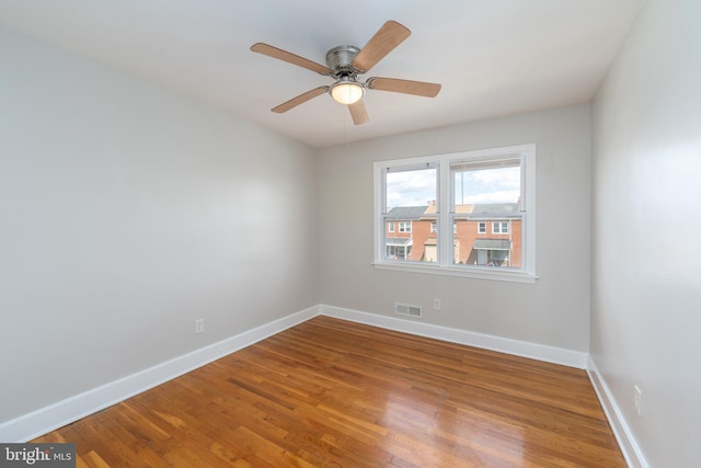 1738 Stokesley Rd, Baltimore, MD 21222 - unfurnished room featuring baseboards, wood finished floors, and ceiling fan