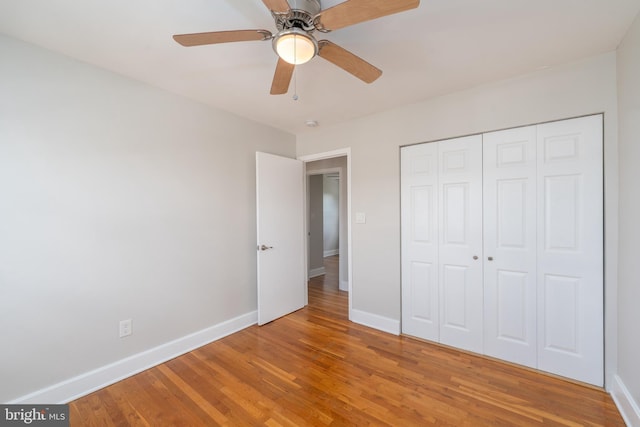 1738 Stokesley Rd, Baltimore, MD 21222 - unfurnished bedroom with light wood finished floors, baseboards, a closet, and ceiling fan
