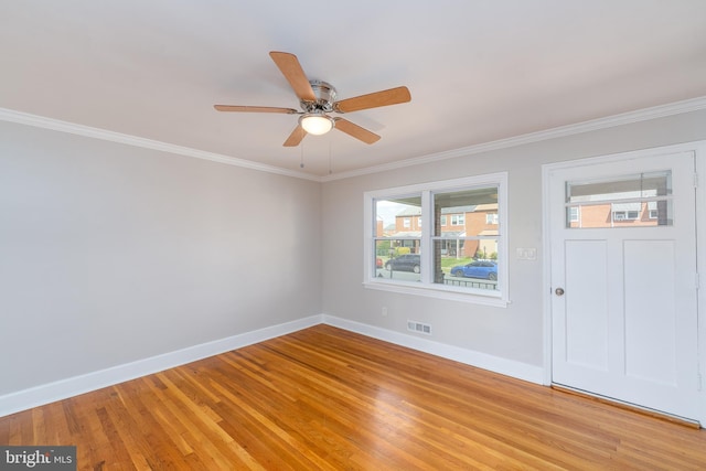 1738 Stokesley Rd, Baltimore, MD 21222 - spare room with baseboards, light wood-style flooring, a ceiling fan, and crown molding