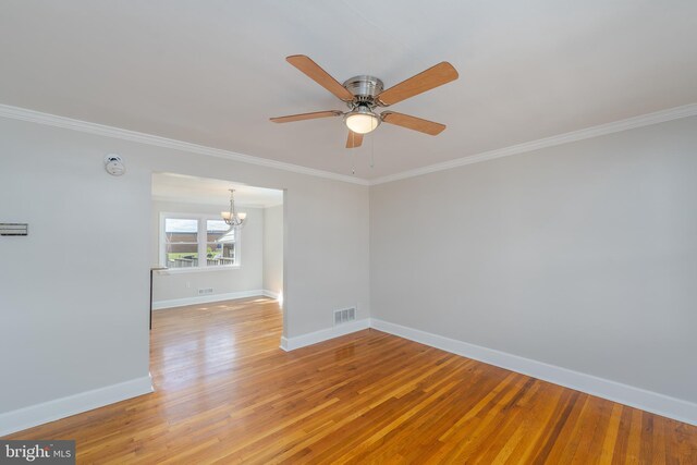 1738 Stokesley Rd, Baltimore, MD 21222 - spare room with a chandelier, ceiling fan, baseboards, crown molding, and light wood-style flooring