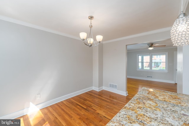 1738 Stokesley Rd, Baltimore, MD 21222 - unfurnished room featuring a chandelier, ornamental molding, wood finished floors, baseboards, and ceiling fan