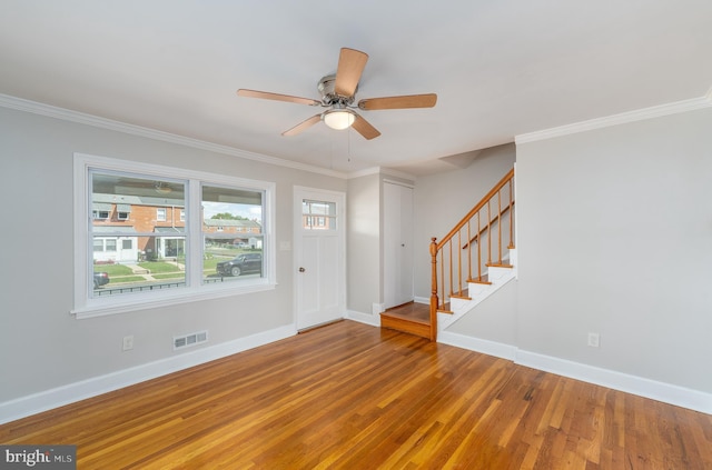 1738 Stokesley Rd, Baltimore, MD 21222 - foyer entrance with baseboards, ceiling fan, wood finished floors, stairs, and ornamental molding