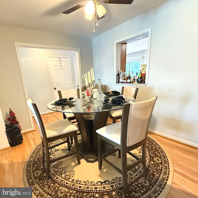 11289 Kessler Pl, Manassas, VA 20109 - dining room featuring wood finished floors, a ceiling fan, and baseboards