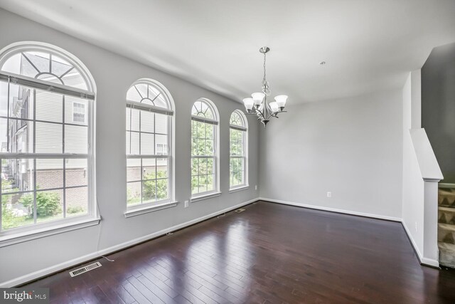 12517 Rustic Rock Ln, Beltsville, MD 20705 - unfurnished room with a chandelier, hardwood / wood-style flooring, and baseboards