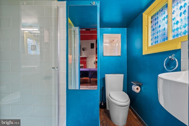 503 N Paca St, Baltimore, MD 21201 - full bath with toilet, wood finished floors, and a tile shower