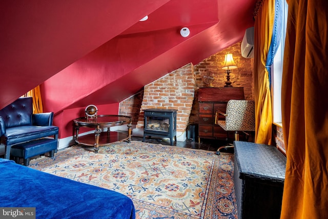 503 N Paca St, Baltimore, MD 21201 - living room with vaulted ceiling, a wall mounted air conditioner, and a glass covered fireplace