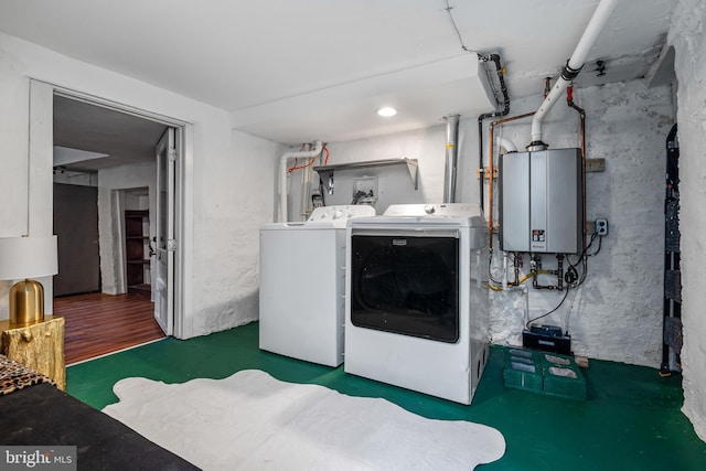 503 N Paca St, Baltimore, MD 21201 - laundry room with washing machine and dryer and water heater