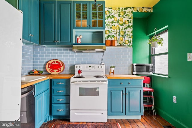 503 N Paca St, Baltimore, MD 21201 - kitchen featuring white appliances, butcher block counters, backsplash, dark wood-type flooring, and baseboards