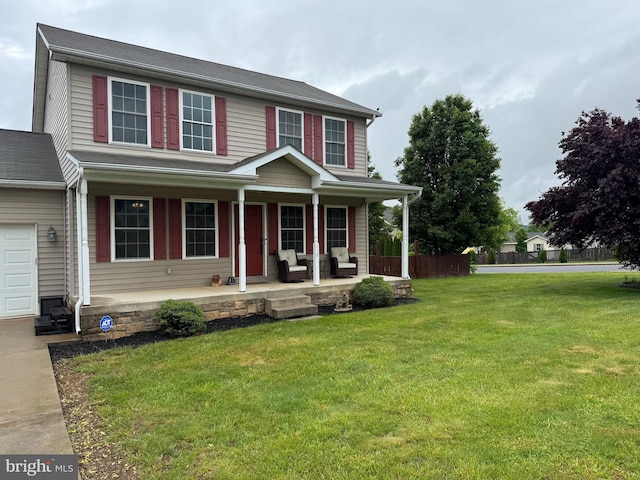 112 Toulouse Ln, Martinsburg, WV 25403 - view of front facade featuring covered porch, a front yard, and a garage