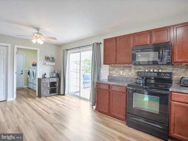 112 Toulouse Ln, Martinsburg, WV 25403 - kitchen featuring black appliances, washer and dryer, decorative backsplash, and a ceiling fan
