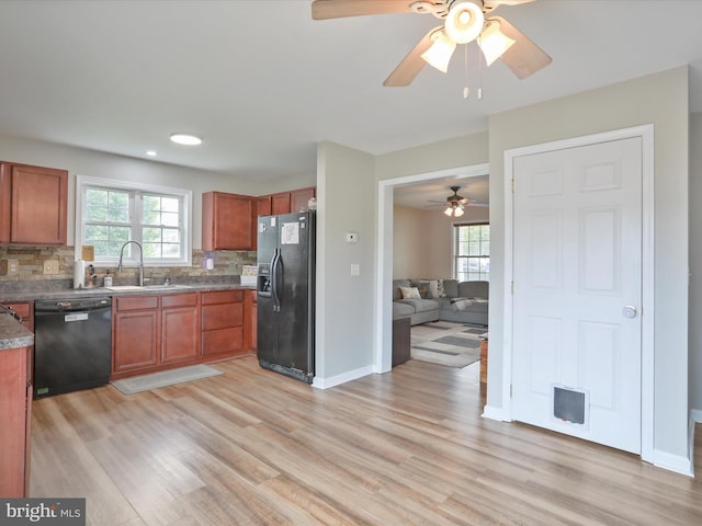 112 Toulouse Ln, Martinsburg, WV 25403 - kitchen featuring black appliances, a sink, light wood-style floors, backsplash, and recessed lighting