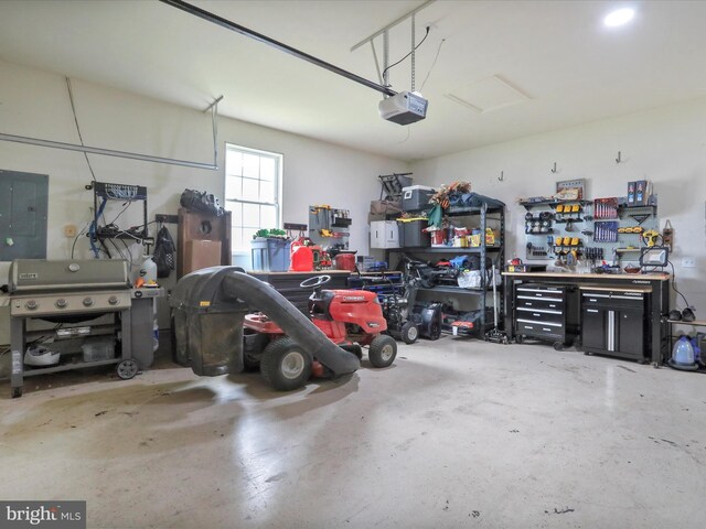 112 Toulouse Ln, Martinsburg, WV 25403 - garage featuring a workshop area, a garage door opener, and electric panel