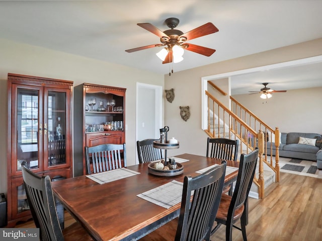 112 Toulouse Ln, Martinsburg, WV 25403 - dining space featuring ceiling fan, stairs, and light wood finished floors