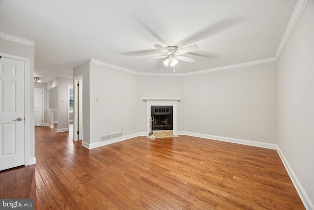 413 Eagle Rd # 7, Wayne, PA 19087 - unfurnished living room with a ceiling fan, wood finished floors, a fireplace with flush hearth, baseboards, and crown molding