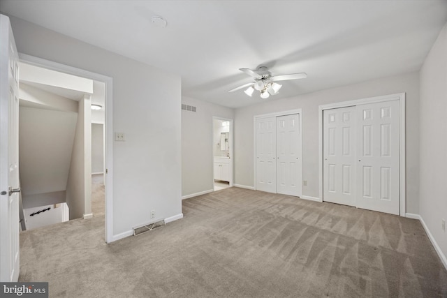 413 Eagle Rd # 7, Wayne, PA 19087 - unfurnished bedroom with two closets, carpet, and baseboards