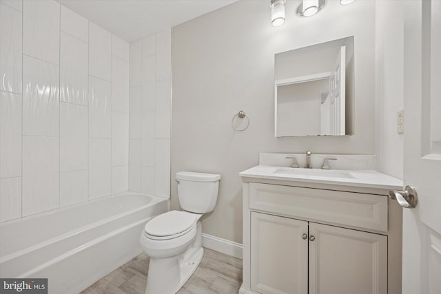 413 Eagle Rd # 7, Wayne, PA 19087 - bathroom with vanity, baseboards, toilet, bathing tub / shower combination, and wood finished floors
