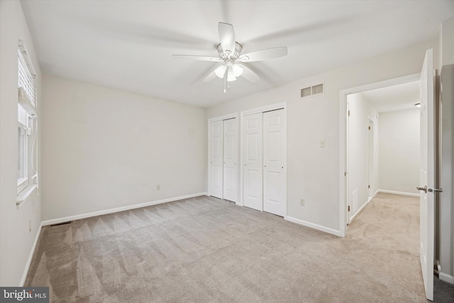 413 Eagle Rd # 7, Wayne, PA 19087 - unfurnished bedroom with carpet floors, multiple closets, and baseboards