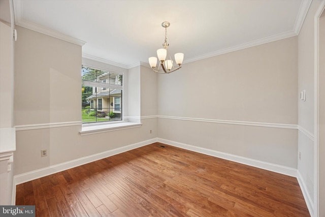 413 Eagle Rd # 7, Wayne, PA 19087 - unfurnished room with a chandelier, crown molding, wood finished floors, and baseboards