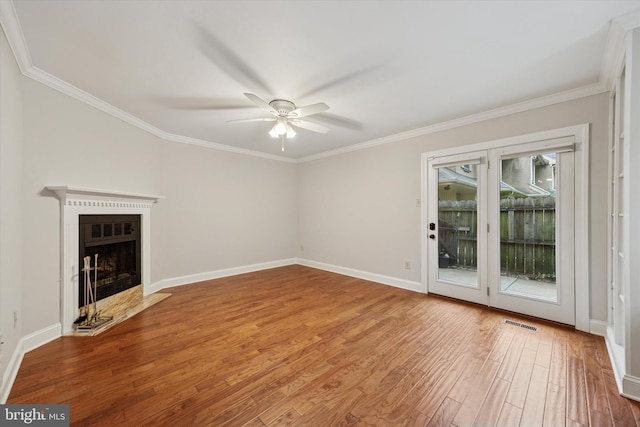 413 Eagle Rd # 7, Wayne, PA 19087 - unfurnished living room featuring a ceiling fan, ornamental molding, wood finished floors, a fireplace with flush hearth, and baseboards