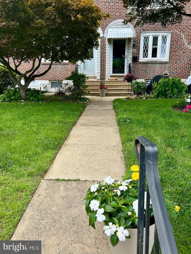 290 Gramercy Dr, Clifton Heights, PA 19018 - view of exterior entry with brick siding and a yard