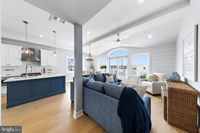 2600 Long Beach Blvd Unit 12, Long Beach Township, NJ 08008 - living room with vaulted ceiling, light wood-style floors, a ceiling fan, a chandelier, and recessed lighting