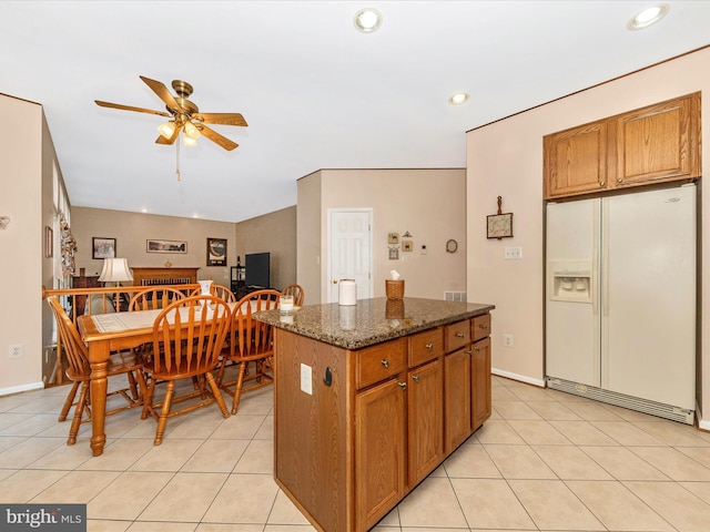 6810 Morrow Way, Frederick, MD 21703 - kitchen with white refrigerator with ice dispenser, ceiling fan, recessed lighting, a center island, and light tile patterned floors