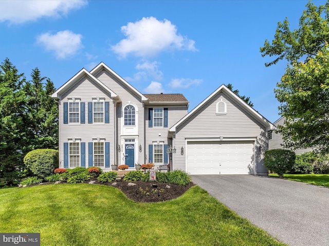 6810 Morrow Way, Frederick, MD 21703 - colonial house featuring asphalt driveway, an attached garage, and a front yard