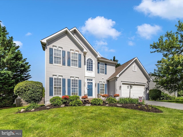 6810 Morrow Way, Frederick, MD 21703 - colonial home with asphalt driveway, an attached garage, and a front yard