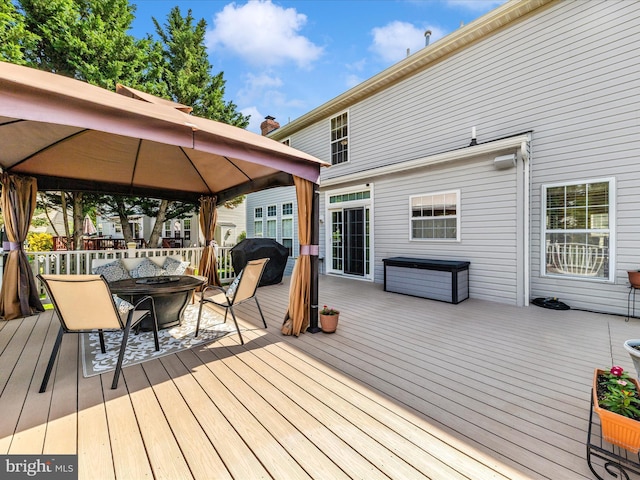 6810 Morrow Way, Frederick, MD 21703 - wooden terrace with a gazebo, a fire pit, and grilling area