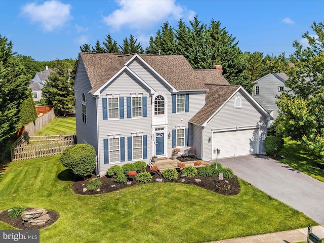 6810 Morrow Way, Frederick, MD 21703 - colonial house featuring driveway, a garage, a chimney, and roof with shingles