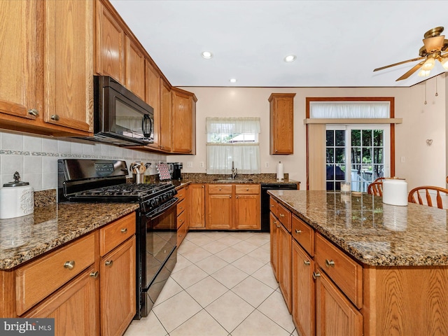 6810 Morrow Way, Frederick, MD 21703 - kitchen with black appliances, a sink, brown cabinetry, and recessed lighting