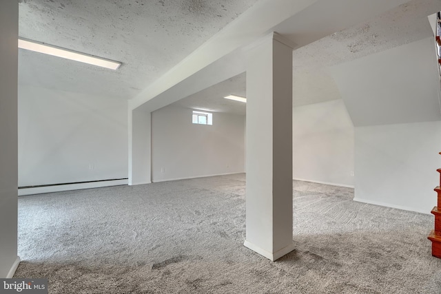 8429 Coco Rd, Baltimore, MD 21237 - basement with carpet flooring, a textured ceiling, baseboard heating, and baseboards