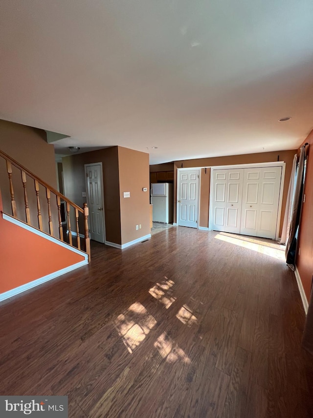 745 Cedar Ct, Red Hill, PA 18076 - unfurnished living room featuring wood finished floors and stairway