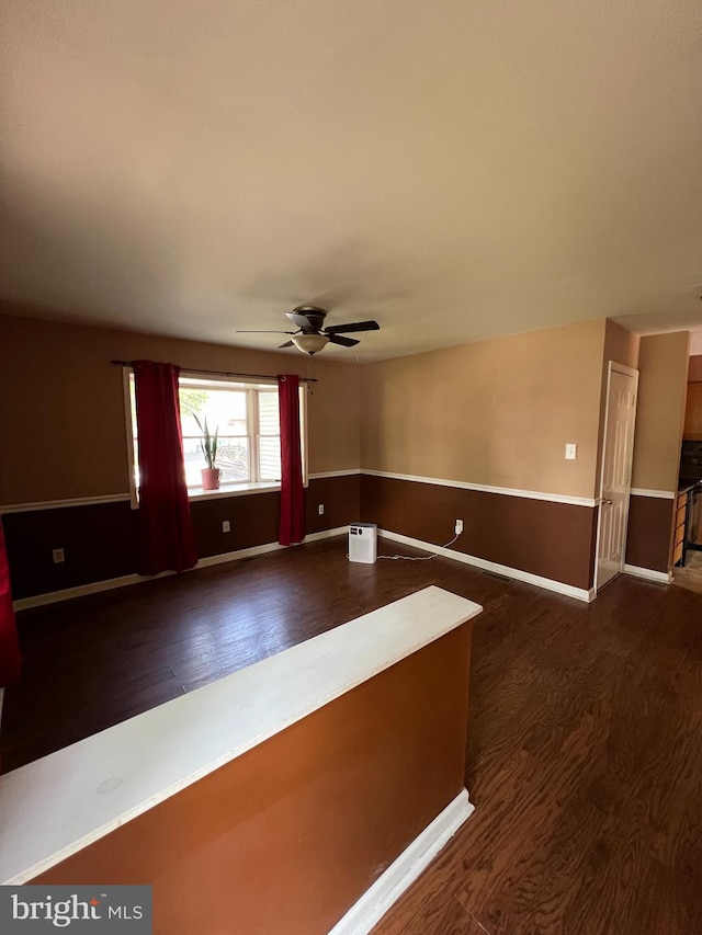 745 Cedar Ct, Red Hill, PA 18076 - empty room with wood finished floors, ceiling fan, and wainscoting