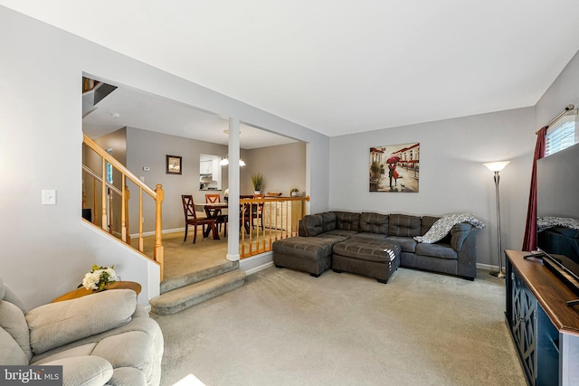1085 Smartts Ln NE, Leesburg, VA 20176 - living area with light colored carpet, stairs, and baseboards