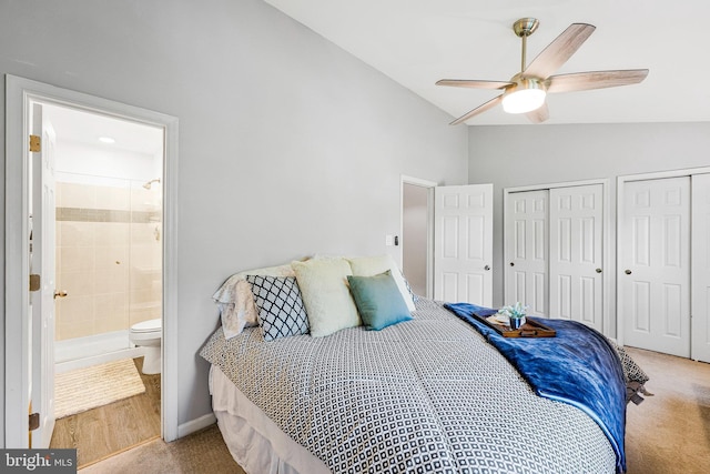 1085 Smartts Ln NE, Leesburg, VA 20176 - bedroom with multiple closets, carpet floors, connected bathroom, a ceiling fan, and high vaulted ceiling