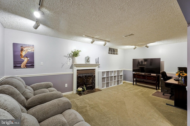 1085 Smartts Ln NE, Leesburg, VA 20176 - living room with track lighting, carpet floors, a textured ceiling, a fireplace with flush hearth, and baseboards