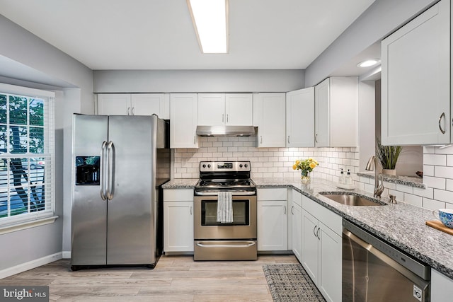 1085 Smartts Ln NE, Leesburg, VA 20176 - kitchen with appliances with stainless steel finishes, under cabinet range hood, a sink, and white cabinetry