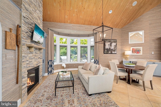 777 3rd St, Herndon, VA 20170 - living room with high vaulted ceiling, light tile patterned flooring, a stone fireplace, wood ceiling, and a chandelier